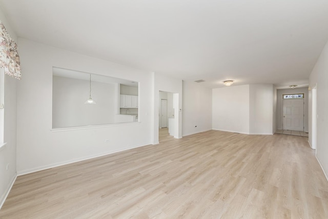 unfurnished living room featuring light wood-type flooring