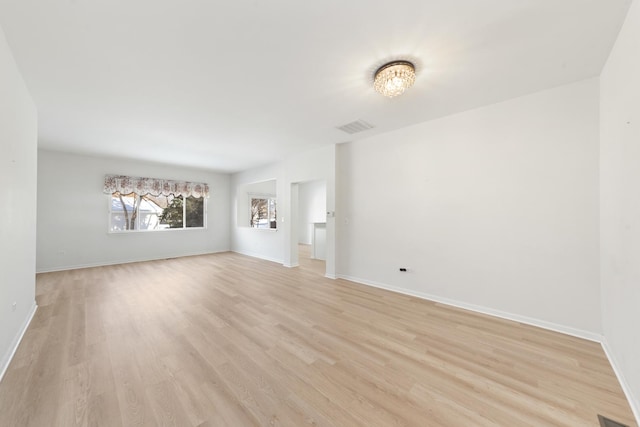 unfurnished room with light hardwood / wood-style flooring