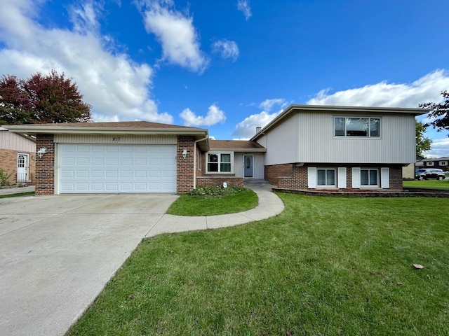 view of front facade with a garage and a front lawn