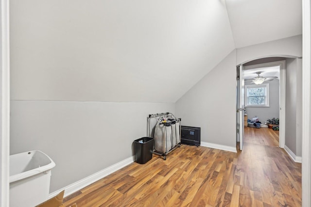 additional living space featuring ceiling fan, wood-type flooring, and lofted ceiling