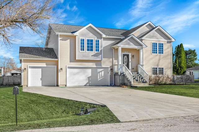 bi-level home featuring a front yard and a garage