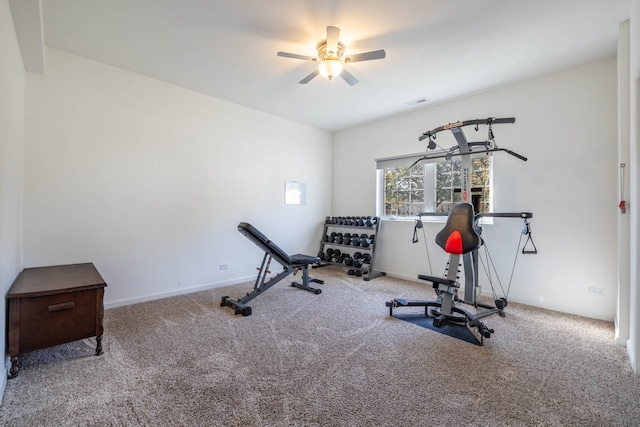 workout area with ceiling fan and carpet floors