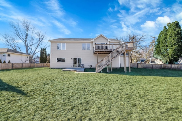 back of property featuring a deck and a yard