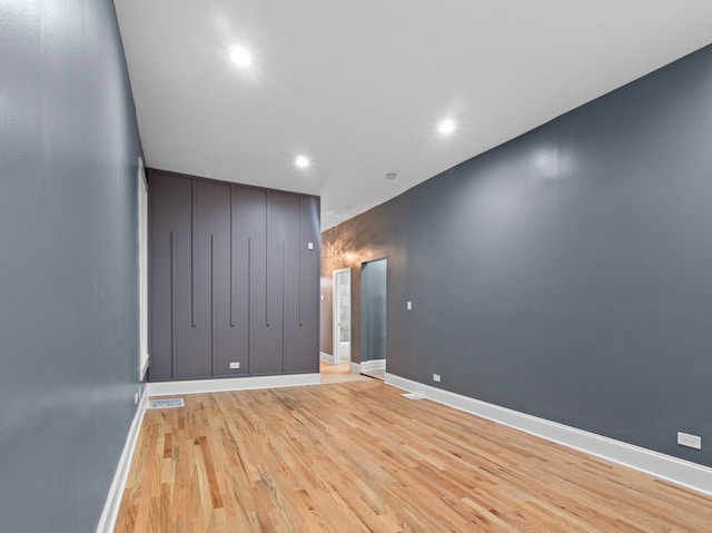 unfurnished room with light hardwood / wood-style floors