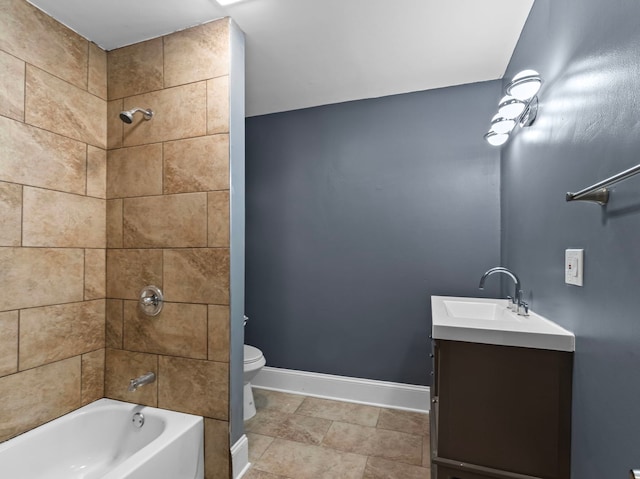 full bathroom with tiled shower / bath combo, vanity, and toilet