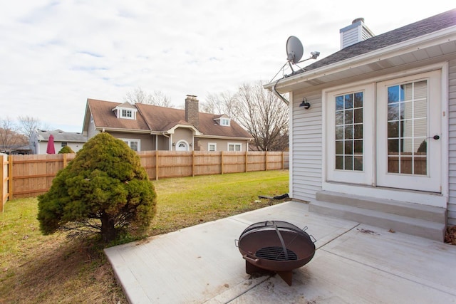 view of patio with an outdoor fire pit