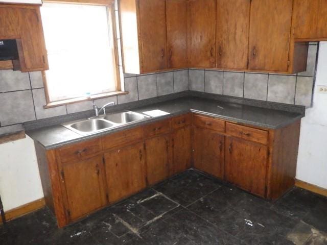 kitchen featuring sink and decorative backsplash