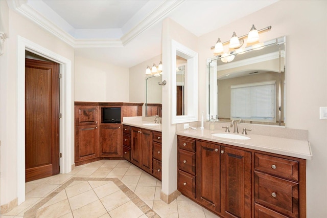 bathroom with tile patterned flooring, a raised ceiling, vanity, and an inviting chandelier