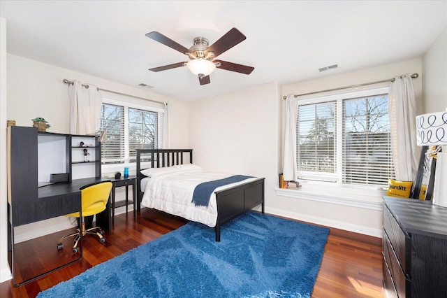 bedroom with ceiling fan and dark wood-type flooring