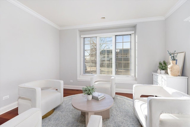 living area with wood-type flooring and ornamental molding