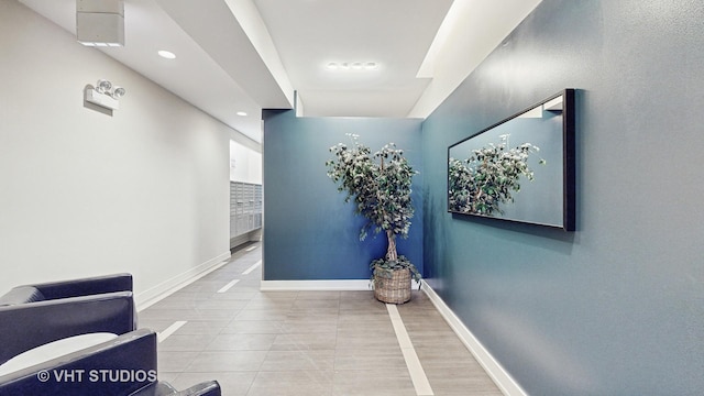 hallway with light tile patterned floors