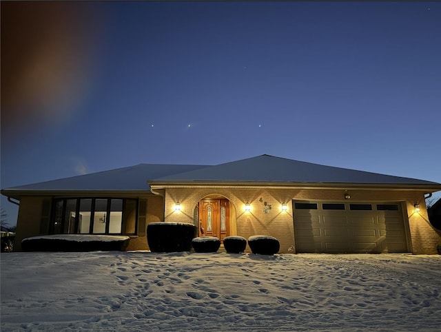 view of front of property with a garage