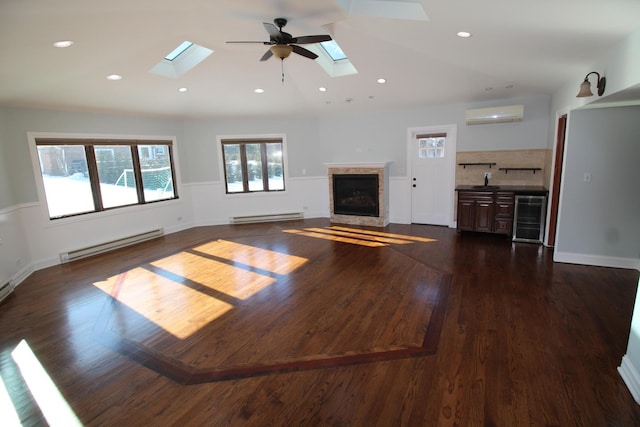 unfurnished living room with dark hardwood / wood-style floors, a baseboard radiator, beverage cooler, and a wall mounted AC