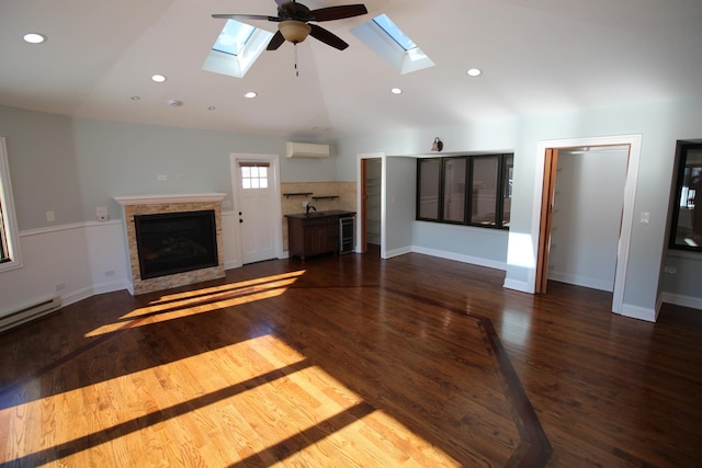 unfurnished living room featuring vaulted ceiling, an AC wall unit, a baseboard radiator, dark hardwood / wood-style floors, and ceiling fan