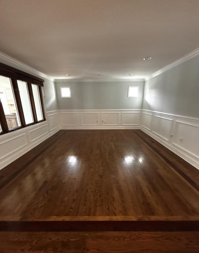 unfurnished room featuring crown molding and dark hardwood / wood-style floors