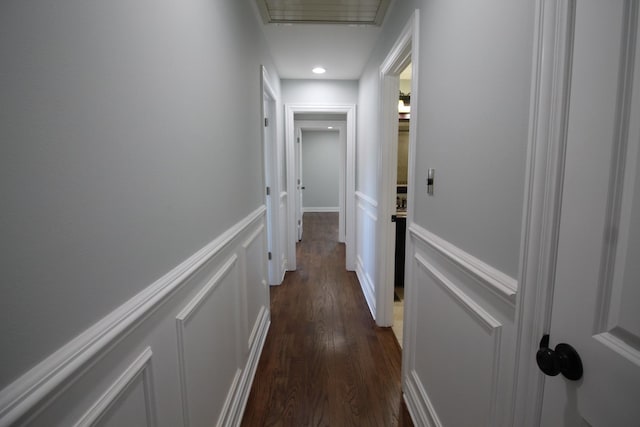 hall with dark hardwood / wood-style flooring