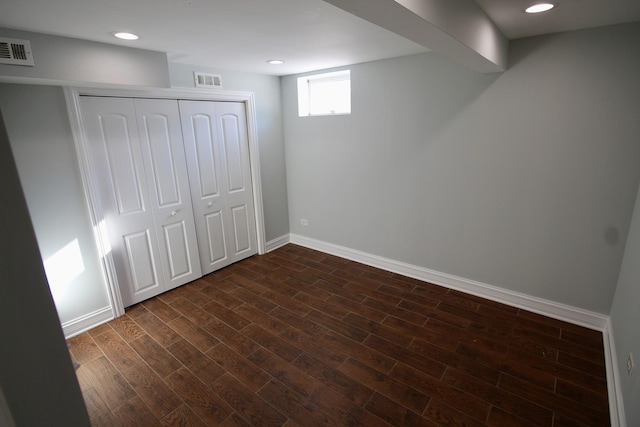 basement with dark wood-type flooring