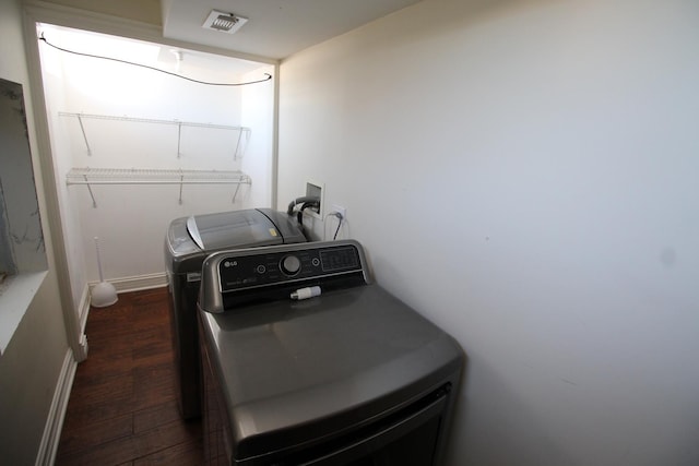 laundry room featuring dark wood-type flooring and washing machine and dryer