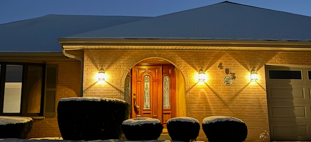 property entrance with a garage