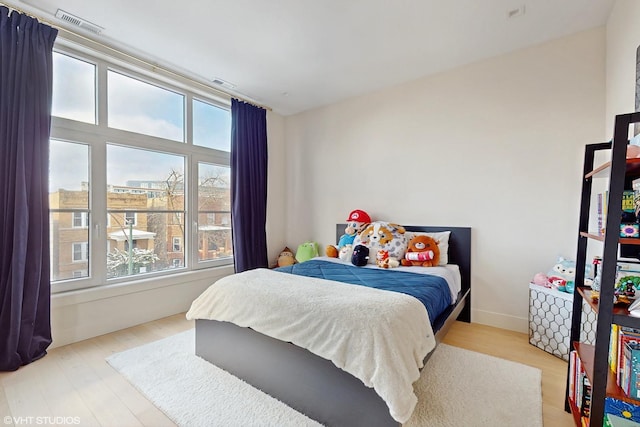 bedroom featuring light wood-type flooring