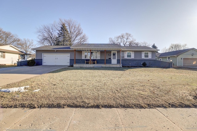 single story home featuring covered porch, a garage, and a front lawn