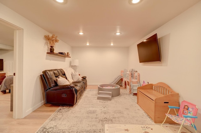 game room featuring light wood-type flooring