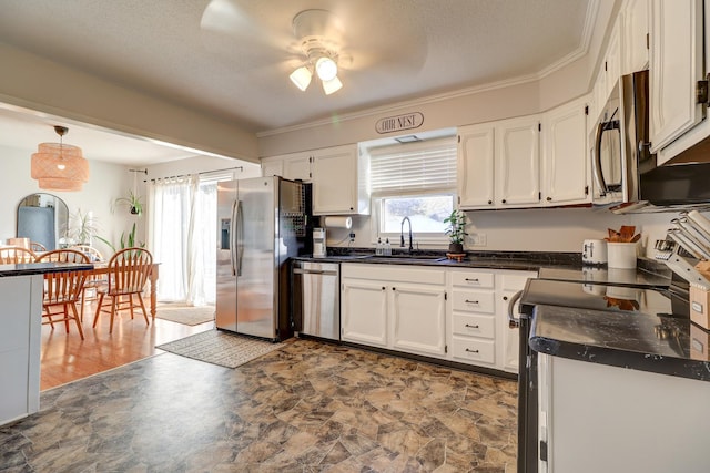 kitchen with white cabinetry, sink, and appliances with stainless steel finishes