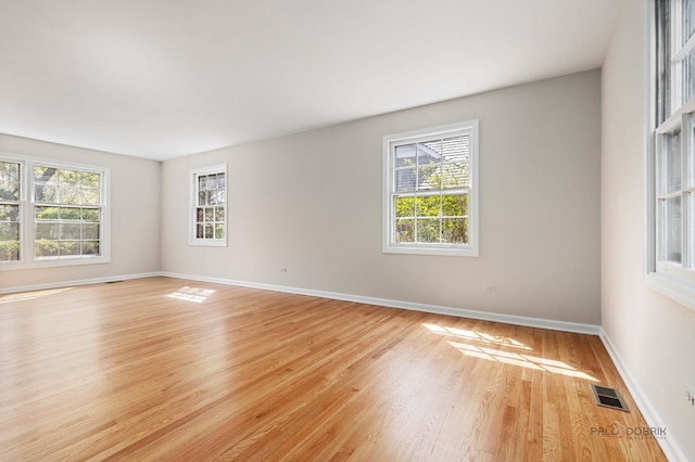 1712 Shawnee Trl, Northbrook, IL 60062 - unfurnished room featuring healthy amount of natural light, light wood finished floors, and baseboards