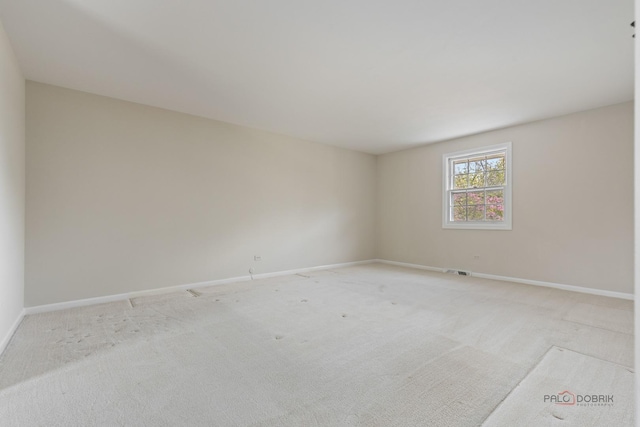1712 Shawnee Trl, Northbrook, IL 60062 - unfurnished room with baseboards and light colored carpet