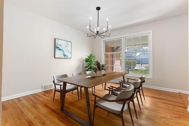 1712 Shawnee Trl, Northbrook, IL 60062 - dining room with a chandelier, baseboards, and light wood-style floors