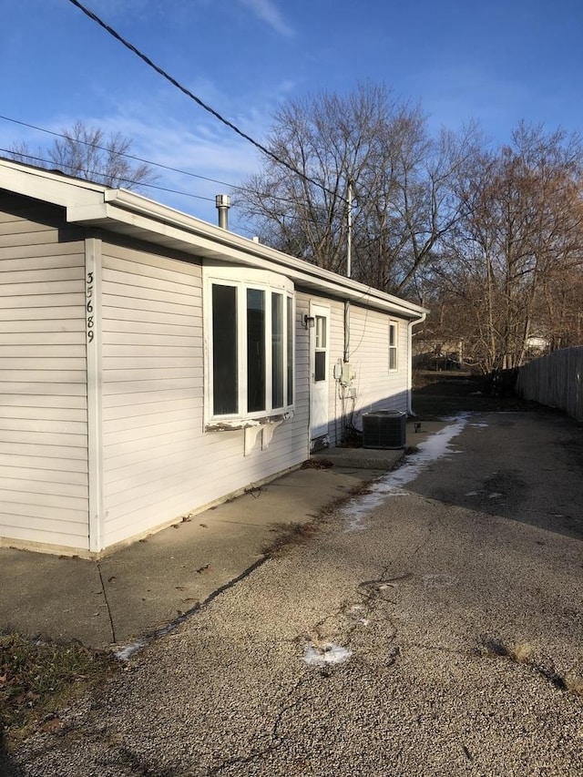 view of home's exterior with central AC