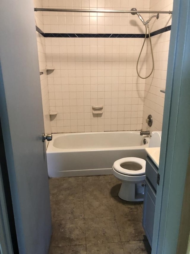 full bathroom featuring vanity, toilet, and tiled shower / bath combo