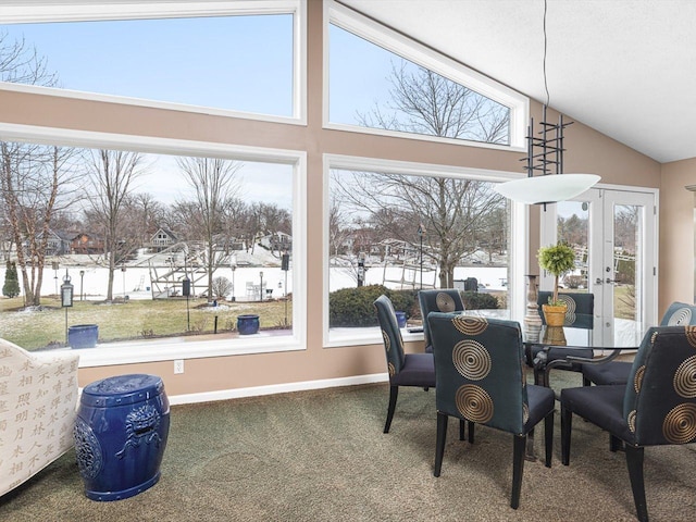 sunroom / solarium featuring vaulted ceiling and french doors