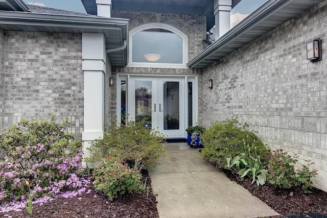 view of exterior entry featuring french doors