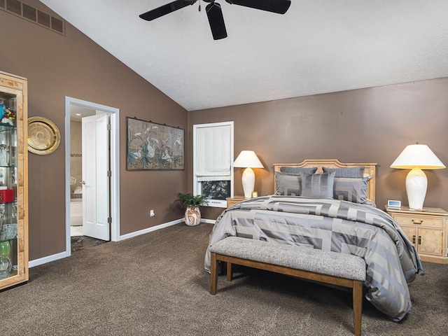 bedroom featuring ensuite bath, ceiling fan, vaulted ceiling, and dark carpet