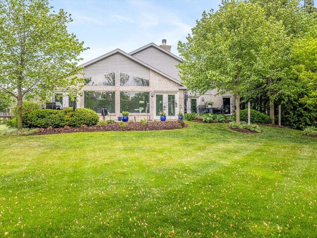 223 Lake Summerset Rd, Davis, IL 61019 - view of front facade with a front lawn and a chimney