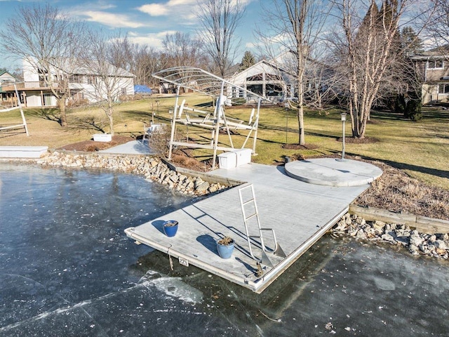 view of dock featuring a yard and a water view