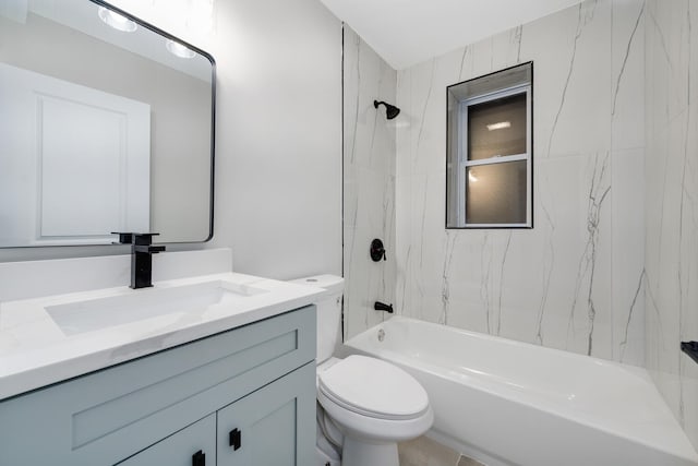 full bathroom featuring toilet, vanity, and tiled shower / bath combo