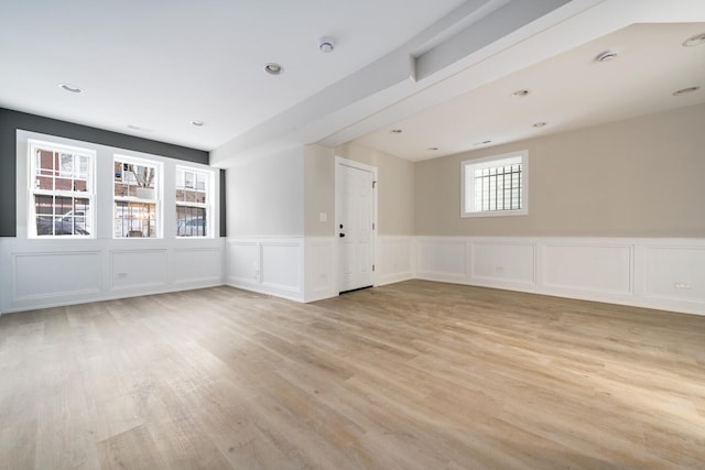 unfurnished room with light hardwood / wood-style flooring