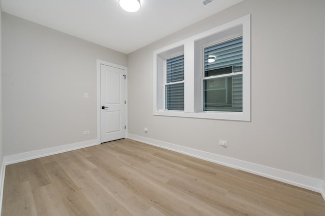 empty room with light wood-type flooring