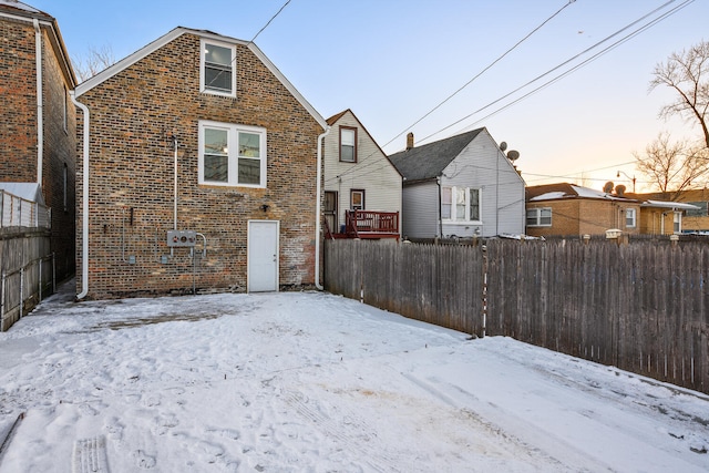 view of snow covered house