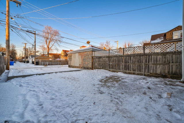 view of yard layered in snow