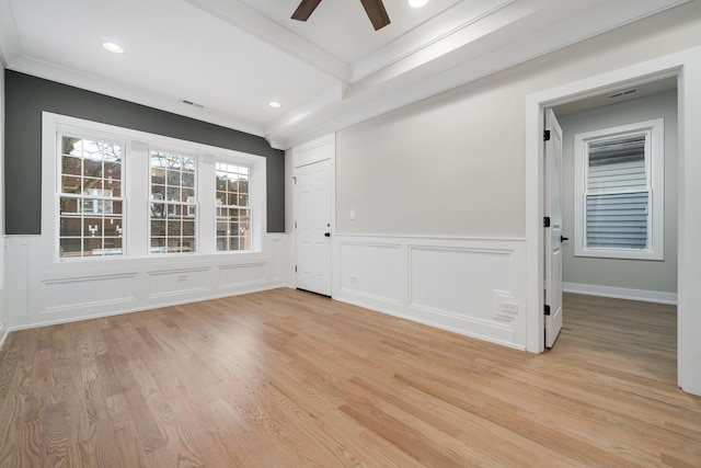 empty room featuring ornamental molding, ceiling fan, and light hardwood / wood-style flooring