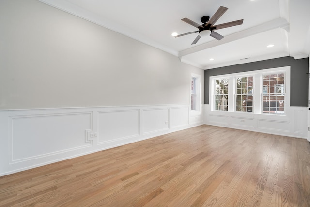 spare room featuring ceiling fan, ornamental molding, and light hardwood / wood-style floors