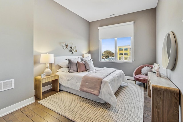 bedroom with hardwood / wood-style floors