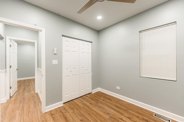 unfurnished bedroom featuring a closet, ceiling fan, and light hardwood / wood-style floors