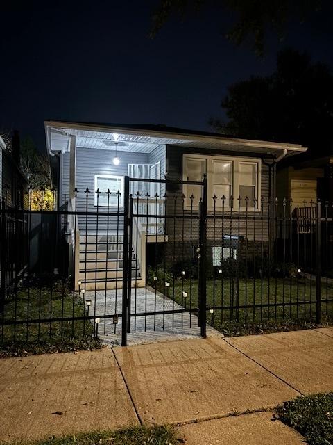 view of gate at twilight