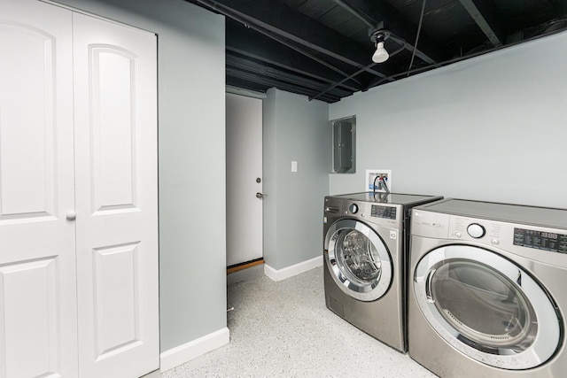 clothes washing area featuring washing machine and dryer and electric panel