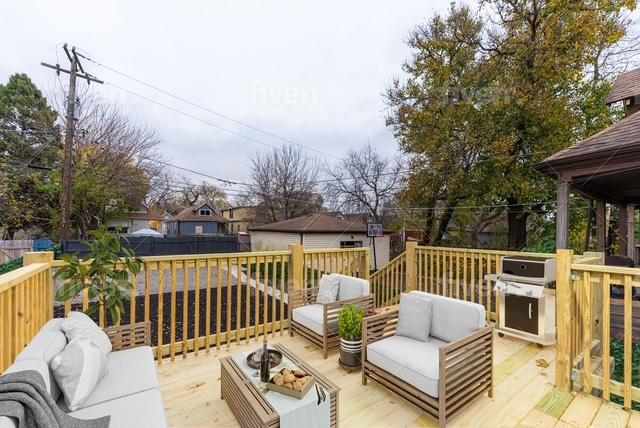 wooden deck featuring an outdoor hangout area and grilling area