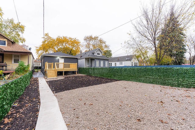 back of house featuring a deck